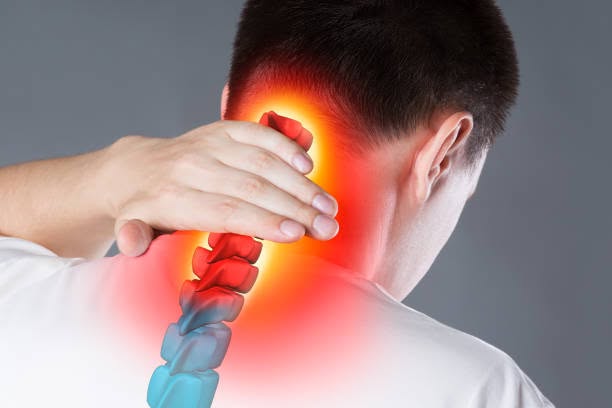 Man holding the back of his neck with a highlighted spine overlay indicating neck pain or inflammation